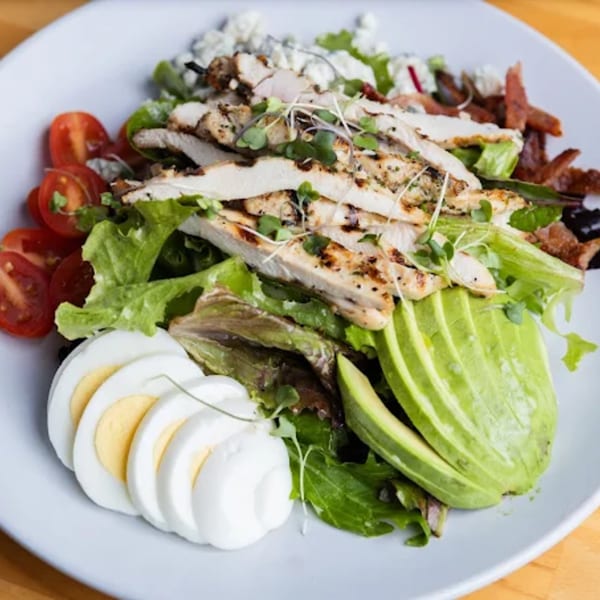 Fandee's Restaurant's Cobb salad with grilled chicken, avocado, tomatoes, eggs, bacon, and blue cheese.